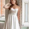 Cassidy wedding dress featuring a fitted bodice and flowing skirt, showcasing elegant bridal detailing for a sophisticated wedding look.